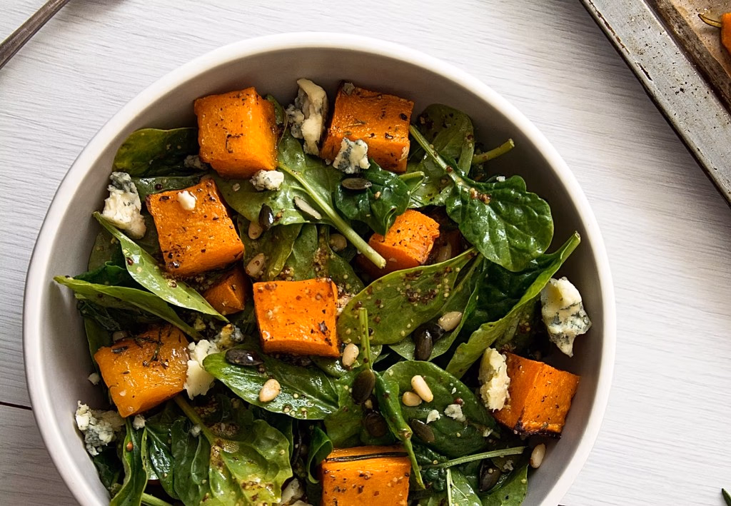 Roasted pumpkin and spinach salad bowl — wholesome, balanced, real food.